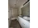 A bathroom featuring dual sinks, granite countertops, and white cabinetry at 990 E Desert Rose Trl, San Tan Valley, AZ 85143