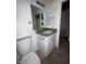 Bathroom features a granite countertop, a mirror, and a medicine cabinet at 990 E Desert Rose Trl, San Tan Valley, AZ 85143