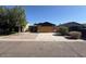 Charming single-story home with low maintenance landscaping and a private two-car garage at 990 E Desert Rose Trl, San Tan Valley, AZ 85143