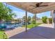 Enjoy relaxing in the covered back patio with views of the tranquil waterfront backyard at 1405 E Chicago Cir, Chandler, AZ 85225