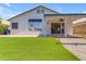Home exterior featuring an artificial lawn, covered back patio and plenty of space to entertain at 1405 E Chicago Cir, Chandler, AZ 85225