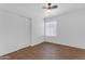 This bedroom offers a ceiling fan, closet, and light-filled window at 1405 E Chicago Cir, Chandler, AZ 85225