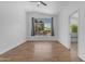 Bright bedroom with tile floors, large window, and view of the backyard at 1405 E Chicago Cir, Chandler, AZ 85225