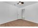 This bedroom offers a ceiling fan and light-filled window at 1405 E Chicago Cir, Chandler, AZ 85225