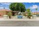 The Springs Swim and Racquet Club community sign with a beautiful mature shade tree at 1405 E Chicago Cir, Chandler, AZ 85225