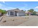 Charming single-Gathering home featuring a well-maintained front yard and attached two-car garage at 1405 E Chicago Cir, Chandler, AZ 85225