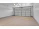 Spacious two car garage with white doors and epoxy floors provides ample storage and parking at 1405 E Chicago Cir, Chandler, AZ 85225