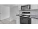 View of the updated kitchen with a white cabinet and stone backsplash at 1405 E Chicago Cir, Chandler, AZ 85225