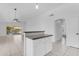 Kitchen island featuring stone countertops and white cabinets at 1405 E Chicago Cir, Chandler, AZ 85225