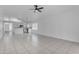 Open-concept space with tile floors offers seamless living and dining, connecting the kitchen and living area at 1405 E Chicago Cir, Chandler, AZ 85225