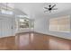 Bright living room with a ceiling fan, window, and vinyl flooring at 1405 E Chicago Cir, Chandler, AZ 85225
