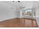 Bright living room with large windows, vaulted ceiling, and vinyl flooring at 1405 E Chicago Cir, Chandler, AZ 85225