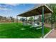Enjoy outdoor gatherings under the shaded picnic area next to the serene lakefront in this vibrant community at 1405 E Chicago Cir, Chandler, AZ 85225