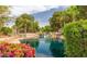Beautiful water feature with waterfall and lush landscaping offers a tranquil escape in this lakeside community at 1405 E Chicago Cir, Chandler, AZ 85225