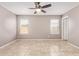 Bright bedroom with tiled floors, neutral walls, and a ceiling fan at 1430 N Ashland --, Mesa, AZ 85203