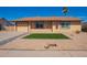 Charming single-story home with a well-manicured front yard and desert landscaping at 1430 N Ashland --, Mesa, AZ 85203