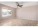 Bright living room featuring tiled floors, neutral walls, and lots of sunlight from the window at 1430 N Ashland --, Mesa, AZ 85203