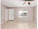 Bright living room with tiled floors, neutral walls, and a large window at 1430 N Ashland --, Mesa, AZ 85203
