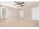 This main bedroom features neutral walls, ceiling fan, and tile flooring; perfect for relaxation at 1430 N Ashland --, Mesa, AZ 85203
