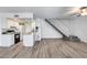 Open-concept living room with sleek floors, white walls, and staircase access at 14644 N Yerba Buena Way # C, Fountain Hills, AZ 85268