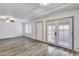 Bright living room boasts wood-look flooring and double doors to the patio at 14644 N Yerba Buena Way # C, Fountain Hills, AZ 85268