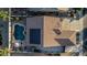Aerial view showcasing a private pool, solar panels, and a well-maintained tile roof at 16077 W Anasazi St, Goodyear, AZ 85338