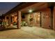 Outdoor living space features cozy seating under a covered patio with a view of the backyard at 16077 W Anasazi St, Goodyear, AZ 85338