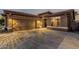 Inviting single-story home with desert landscaping, spacious driveway, and a convenient two-car garage at 16077 W Anasazi St, Goodyear, AZ 85338