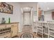 Inviting hallway featuring tile flooring, a view of the kitchen, and stylish decor at 16077 W Anasazi St, Goodyear, AZ 85338