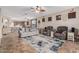 An open-concept living room flows into the dining and kitchen area and offers great space for relaxing at 16077 W Anasazi St, Goodyear, AZ 85338