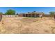 Spacious backyard with partial landscaping and desert views offering space for outdoor activities at 1676 W Sequoia Dr, Phoenix, AZ 85027