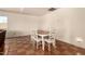 Dining area featuring tile flooring and a modern dining set at 1676 W Sequoia Dr, Phoenix, AZ 85027