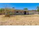 Single-story home with solar panels, light-colored siding and desert landscaping at 1676 W Sequoia Dr, Phoenix, AZ 85027