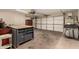 Organized garage space with a workbench, tool storage, and plenty of room for parking at 1676 W Sequoia Dr, Phoenix, AZ 85027
