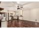 Well-lit kitchen with stainless steel appliances, dark wood-style floors, and modern design at 1676 W Sequoia Dr, Phoenix, AZ 85027
