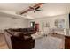 Cozy living room with tile flooring, furniture, and view of dining area at 1676 W Sequoia Dr, Phoenix, AZ 85027