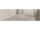 This carpeted bedroom features bright-white trim and doors, as well as neutral walls at 17032 W Cavedale Dr, Surprise, AZ 85387