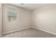 This cozy bedroom features neutral carpet and a bright window allowing ample natural light at 17032 W Cavedale Dr, Surprise, AZ 85387