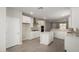 Bright kitchen featuring white cabinets, stainless steel appliances, and a center island at 17032 W Cavedale Dr, Surprise, AZ 85387