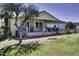 Relaxing outdoor living with a large screened porch, white railing, and easy access to the backyard at 17200 W Bell Rd # 1602, Surprise, AZ 85374