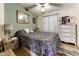 Cozy bedroom featuring a ceiling fan and a patterned bedspread with decorative accents at 17200 W Bell Rd # 1602, Surprise, AZ 85374
