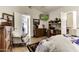 Comfortable bedroom featuring hardwood floors, a golf-themed television, and stylish decor at 17200 W Bell Rd # 1602, Surprise, AZ 85374