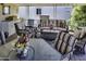 Relaxing covered patio area furnished with comfortable seating and decorative accents with golf course views at 17200 W Bell Rd # 1602, Surprise, AZ 85374