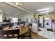 Open floor plan showcasing the dining area and kitchen with stainless steel appliances, creating a seamless flow at 17200 W Bell Rd # 1602, Surprise, AZ 85374