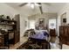 Comfortable primary bedroom with ample natural light, complemented by a desk, dresser, and stylish decor at 17200 W Bell Rd # 1602, Surprise, AZ 85374