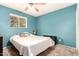 Comfortable bedroom with a large window and plush carpet, creating a relaxing space at 1807 E Jamaica Ave, Mesa, AZ 85204