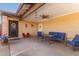 Inviting covered patio with ample seating and ceiling fan, ideal for outdoor gatherings and relaxation at 1807 E Jamaica Ave, Mesa, AZ 85204