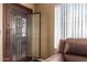 Welcoming front door with security screen and view of an open living space with natural light streaming through at 1807 E Jamaica Ave, Mesa, AZ 85204