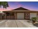 Charming brick home with a two-car garage and cozy covered patio, perfect for outdoor relaxation and curb appeal at 1807 E Jamaica Ave, Mesa, AZ 85204