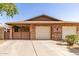 Charming brick home with a two-car garage and cozy covered patio, perfect for outdoor relaxation and curb appeal at 1807 E Jamaica Ave, Mesa, AZ 85204